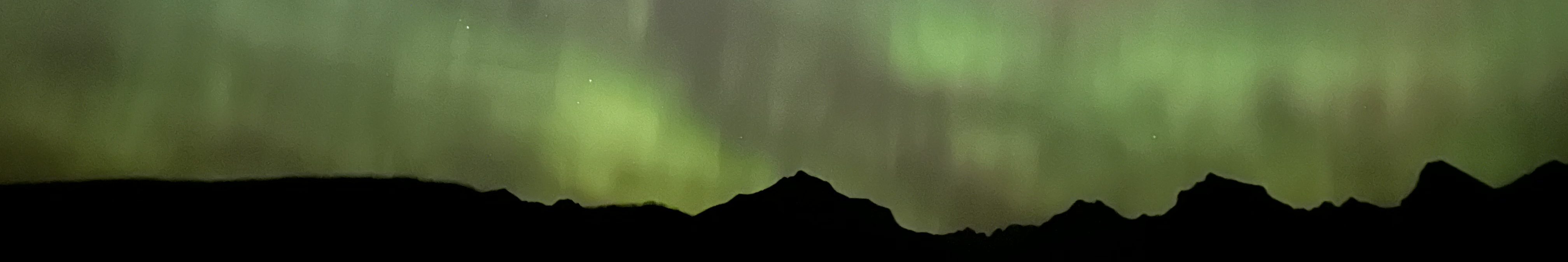 aurora over mountains